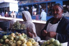 Man and woman selling fruit in the market