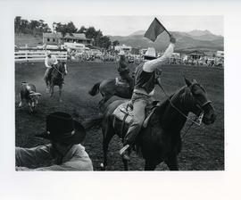 [Cowboys and a Young Bull]