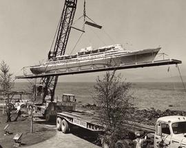 Transco Sevices Ltd. truck hoisting a model of a ship