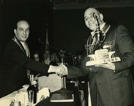 Myer Moscovitch being presented with the Al Jackson - membership award trophy for 1958