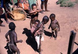 Unidentified South African children playing in traditional ethnic attire