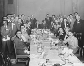 Group surrounding banquet table