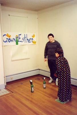 [Purim - children in costumes playing a game]