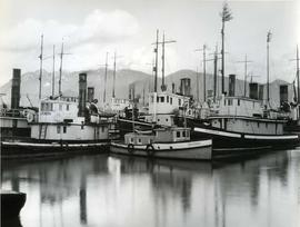 Vessels crowded along dock, including the "Jessie Mac", the "Stormking",  and...