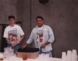 Two young men serving drinks for the JCC  Party