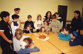 [Group of children around a table]