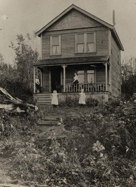 Women and child in front yard