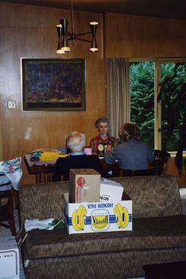 [Dr. Irving and Phyliss Snider sitting at a table with an unknown woman]