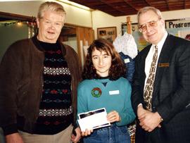 [Bernie Simpson and a man identified as Bob posing beside an adolescent girl]