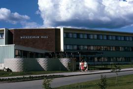 People walking by the Wickersham Hall, part of the University of Alaska in Fairbanks