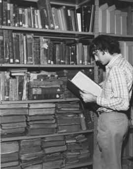 A researcher looks through one of the numerous old volumes housed in the Canadian Jewish Congress...