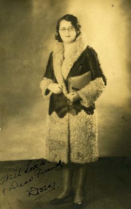 Dora Nesbit [posing in a jacket]