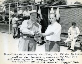 President Ace Hersh presenting the trophy to P.P. Bro. Sam Gordon Capt. of the Shlemeels, winners...