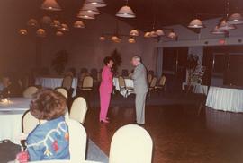 [Shirley Barnett and an unknown man, possibly Joe Segal, on a dance floor]