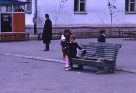 People sitting at a bus stop