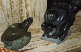 [Two of Phyliss Snider's sandstone Inuit carving]