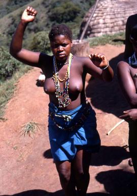 Unidentified South African woman wearing traditional ethnic attire, necklaces made of beads, and ...