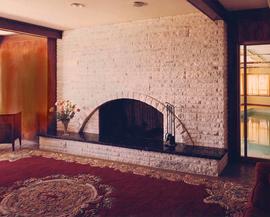 A stone fireplace and hearth, Interior of the Ross Residence, Vancouver, BC