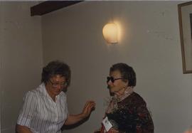 Rae Aceman presents Thelma Ginsberg with flowers