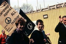 People holding signs to protest against nuclear war