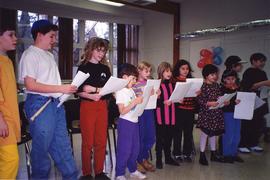 [Purim (possibly) - children singing / reading]