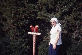 Phyliss Snider with two parrots at Grant's Farm