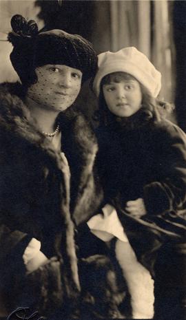 Unidentified woman and child in fur coats