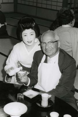 [Dr. Irving Snider posing with an unknown woman in Japanese traditional dress]