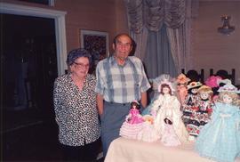 Esther and Ben Dayson, with display of dolls dressed in costumes made by Esther