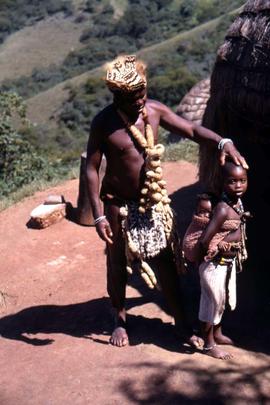 Unidentified South African  man and child in traditional ethnic dress