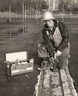 Construction worker using a Ramset tool, Tryson and Son Works Ltd.