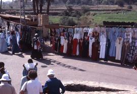 [Market - clothing on display]