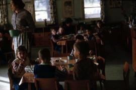 Children eating at tables