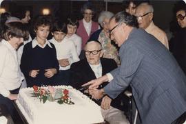 Cutting the cake at Louis Brier celebration