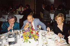 [Esther Dayson, Ben Dayson and Phyliss Snider eating at an unknown event]