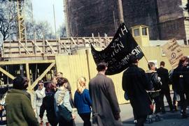 People walking down the street protesting against nuclear war