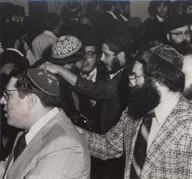 Men dancing after wedding ceremony