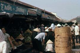 Crowded street market offering produce